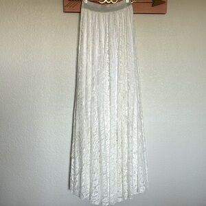 Lace maxi circle skirt with white lining, silver elastic waistband size medium
